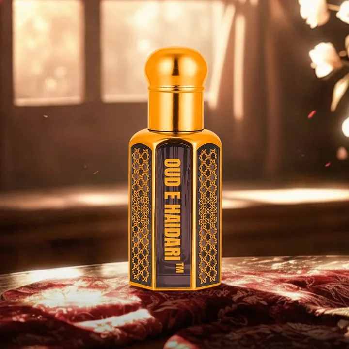 Oud-E-Haidari attar bottle in warm golden light setting with elegant reflections