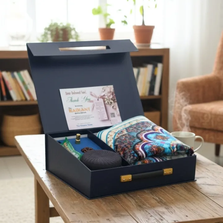 The Radiant premium gift box with prayer essentials and attar bottle on wooden table