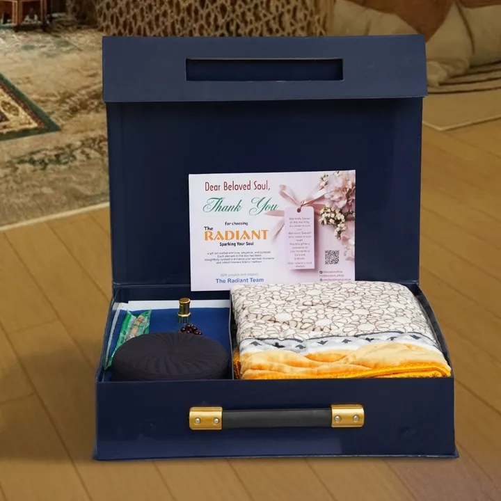 Elegant version of The Radiant gift box with folded prayer mat, attar, and thank you note