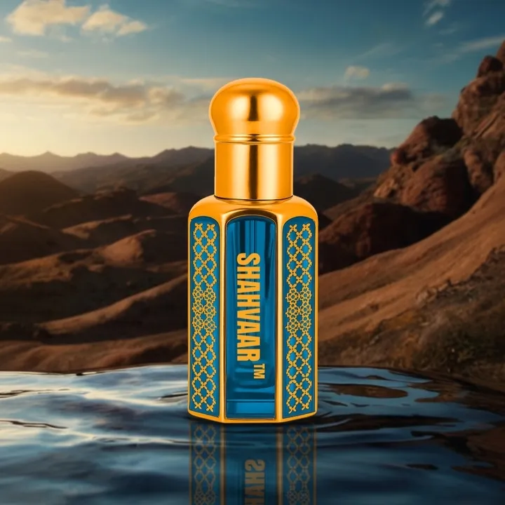 Majestic attar bottle on elegant dark table with golden top and blue design